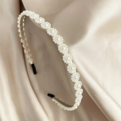 Diadema de perlas